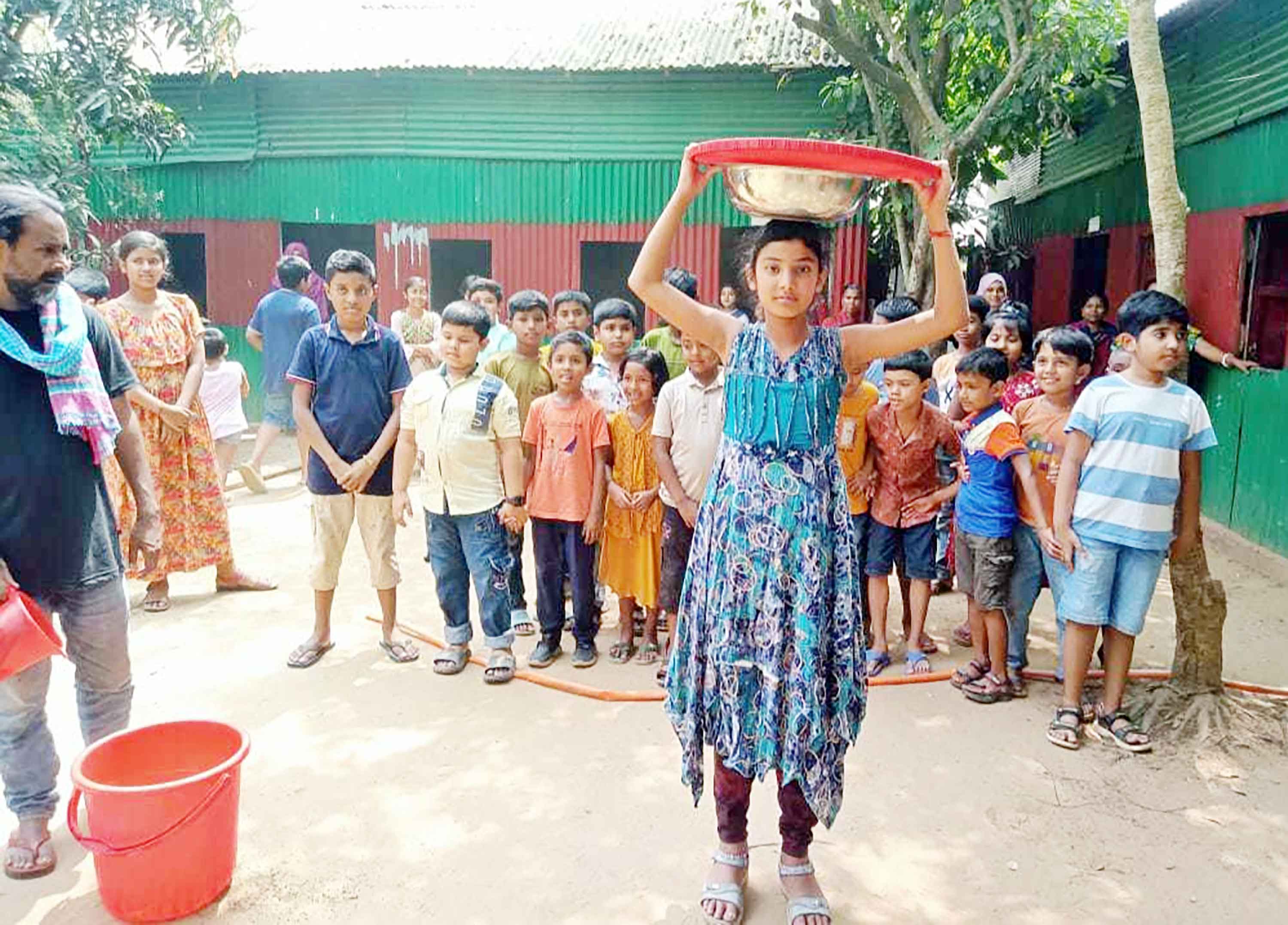 নালিতাবাড়ীতে শিক্ষার্থীদের নেচে-গেয়ে বৃষ্টি প্রার্থনা